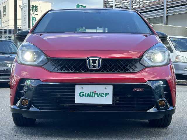 ホンダ フィット e:HEV RS 奈良県 2024(令6)年 0.9万km プレミアムクリスタルレッドM 純正エアロ/ハーフレザー/社外AW（純正積込）/追従式クルコン/Bluetooth/ETC2.0/フルセグTV/ブレーキホールド/パドルシフト/バックカメラ/パドルシフト/スマートキー/UAB付/純正スタートスイッチカバー/プッシュスタート/取扱説明書