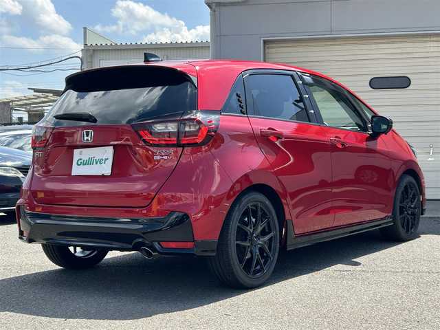 ホンダ フィット e:HEV RS 奈良県 2024(令6)年 0.9万km プレミアムクリスタルレッドM 純正エアロ/ハーフレザー/社外AW（純正積込）/追従式クルコン/Bluetooth/ETC2.0/フルセグTV/ブレーキホールド/パドルシフト/バックカメラ/パドルシフト/スマートキー/UAB付/純正スタートスイッチカバー/プッシュスタート/取扱説明書