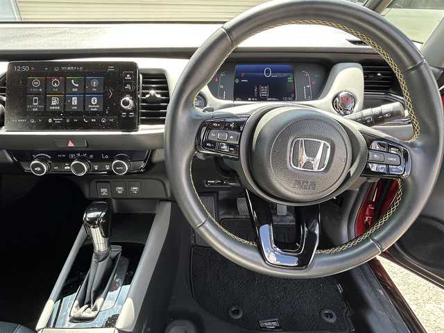 ホンダ フィット e:HEV RS 奈良県 2024(令6)年 0.9万km プレミアムクリスタルレッドM 純正エアロ/ハーフレザー/社外AW（純正積込）/追従式クルコン/Bluetooth/ETC2.0/フルセグTV/ブレーキホールド/パドルシフト/バックカメラ/パドルシフト/スマートキー/UAB付/純正スタートスイッチカバー/プッシュスタート/取扱説明書