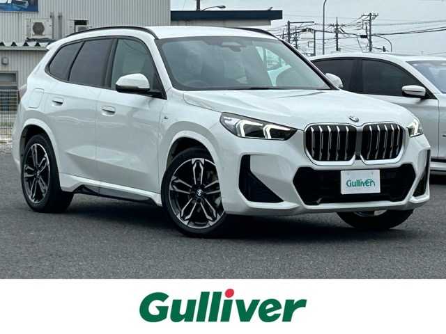 ＢＭＷ ＢＭＷ Ｘ１ xDrive 20d Mスポーツ 千葉県 2025(令7)年 0.1万km アルピンホワイトⅢ ４WD/純正ナビ/Bluetooth/ETC/アレクサ/電動リアゲート/前後ドライブレコーダー/前後コーナーセンサー/全周囲カメラ/バック/サイド/フロントカメラ/車内カメラ/置くだけ充電/ブラインドスポットモニター/レーン・キーピング・アシスト/アダプティブ・クルーズ・コントロール/アクティブ・ブラインド・スポット・ディテクション/前車接近警告機能/後方クロス・トラフィック・ウォーニング/パーキング・アシスタント/ダイナミック・スタビリティ・コントロール/オートマチックハイビーム/ウィンカーミラー/ステアリングスイッチ/プッシュスタート/スマートキー/スペアキー１本/LEDヘッドライト/純正アルミホイール