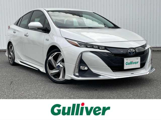 トヨタ プリウス ＰＨＶ A プレミアム 滋賀県 2021(令3)年 5.2万km プラチナホワイトパールマイカ ワンオーナー/モデリスタエアロ/モデリスタ1８インチAW/純正８型ディスプレイ/・Bluetooth/ミラキャスト/パノラミックビューモニター/ステアリングリモコン/AC100V/パーキングアシスト/ETC/前方ドライブレコーダー/レーダクルーズコントロール/置くだけスマホ充電/運転席パワーシート/前席シートヒーター/ベンチレーション/トヨタセーフティセンス/・レーントレーシングアシスト/・プリクラッシュセーフティ/・パーキングサポートブレーキ/・ブラインドスポットモニター/・ロードサインアシスト/・先行車発進お知らせ/ヘッドアップディスプレイ/LEDオートライト/フォグライト/オートハイビーム/充電ケーブル/インテリアイルミネーション/ドライブサポートイルミネーション/スマートキー