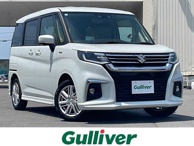 スズキ ソリオ HV MZ 道北・旭川 2020(令2)年 2万km ピュアホワイトP ・４WD/・禁煙車/・メーカーOP純正9インチナビ/・全方位カメラ/・LEDヘッドライト/フォグ/・フリップダウンモニター/・両側電動スライドドア/・衝突軽減ブレーキ/・レーンキープアシスト/・クルーズコントロール/・ミラーヒーター/・前後ドライブレコーダー/・ヘッドアップディスプレイ/・革調シートカバー/・ビルトインETC/・オートライト/・純正フロアマット/・スペアキー/・保証書＆取扱説明書