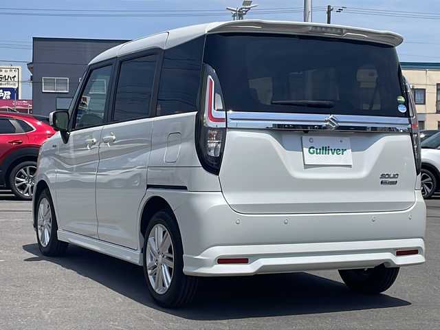 スズキ ソリオ HV MZ 道北・旭川 2020(令2)年 2万km ピュアホワイトP ・４WD/・禁煙車/・メーカーOP純正9インチナビ/・全方位カメラ/・LEDヘッドライト/フォグ/・フリップダウンモニター/・両側電動スライドドア/・衝突軽減ブレーキ/・レーンキープアシスト/・クルーズコントロール/・ミラーヒーター/・前後ドライブレコーダー/・ヘッドアップディスプレイ/・革調シートカバー/・ビルトインETC/・オートライト/・純正フロアマット/・スペアキー/・保証書＆取扱説明書