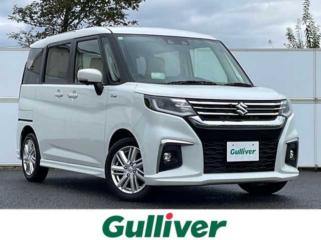 スズキ ソリオ HV MZ 岩手県 2020(令2)年 2万km ピュアホワイトパール 9型ナビ フリップダウン 全周囲C 両側電動スライド ヘッドアップディスプレイ Bluetooth DVD再生 革調シートカバー USB接続 ETC クルーズコントロール ドライブレコーダー シートヒーター 純正15AW スマートキー