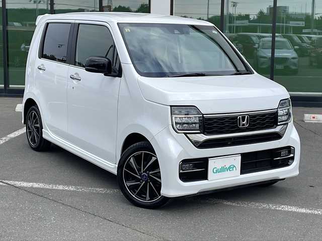 ホンダ Ｎ ＷＧＮ カスタム Lターボ 道東・釧路十勝 2023(令5)年 1.1万km プラチナホワイトパール ・４WD/・純正メモリナビ/（CD・DVD・AM・FM・BT・USB・フルセグ）/・バックカメラ/・ETC/・純正エンジンスターター/・パドルシフト/・レーダークルーズコントロール/・前席シートヒーター/・ヒーテッドドアミラー/・横滑り防止装置/・白線逸脱防止機能/・衝突被害軽減ブレーキ/・レザーシート/・純正フロアマット/・スマートキー/・プッシュスタート/・保証書/・取扱説明書/・社外アルミ付冬タイヤ積込/（155/65/14　2020年製 ５ｍｍ）