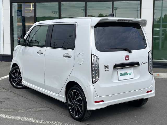 ホンダ Ｎ ＷＧＮ カスタム Lターボ 道東・釧路十勝 2023(令5)年 1.1万km プラチナホワイトパール ・４WD/・純正メモリナビ/（CD・DVD・AM・FM・BT・USB・フルセグ）/・バックカメラ/・ETC/・純正エンジンスターター/・パドルシフト/・レーダークルーズコントロール/・前席シートヒーター/・ヒーテッドドアミラー/・横滑り防止装置/・白線逸脱防止機能/・衝突被害軽減ブレーキ/・レザーシート/・純正フロアマット/・スマートキー/・プッシュスタート/・保証書/・取扱説明書/・社外アルミ付冬タイヤ積込/（155/65/14　2020年製 ５ｍｍ）