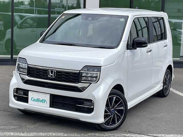ホンダ Ｎ ＷＧＮ カスタム Lターボ 道東・釧路十勝 2023(令5)年 1.1万km プラチナホワイトパール ・４WD/・純正メモリナビ/（CD・DVD・AM・FM・BT・USB・フルセグ）/・バックカメラ/・ETC/・純正エンジンスターター/・パドルシフト/・レーダークルーズコントロール/・前席シートヒーター/・ヒーテッドドアミラー/・横滑り防止装置/・白線逸脱防止機能/・衝突被害軽減ブレーキ/・レザーシート/・純正フロアマット/・スマートキー/・プッシュスタート/・保証書/・取扱説明書/・社外アルミ付冬タイヤ積込/（155/65/14　2020年製 ５ｍｍ）