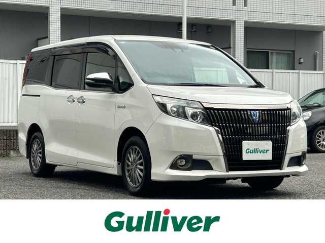 トヨタ エスクァイア ハイブリッド Gi ブラックテーラード 愛知県 2016(平28)年 12.1万km ホワイトパールクリスタルシャイン 純正9型ナビ【Bluetooth CD DVD SD フルセグ　品番：NSZT-Y64T】/バックカメラ/ビルトインETC/デジタルインナーミラー/ドライブレコーダー/両側パワースライドドア/クルーズコントロール/トヨタセーフティセンス/・衝突軽減ブレーキ/・レーンキープアシスト/・オートマチックハイビーム/オートライト/LEDヘッドライト/フォグランプ/先行車発信告知/車両接近通報装置/レザーシート/前席シートヒーター/ステアリングリモコン/ドアバイザー/オート電動格納ドアミラー/禁煙車