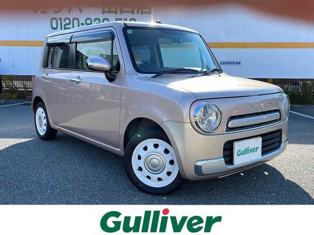 スズキ ラパン ショコラ X 山口県 2014(平26)年 8.9万km シャンパンピンクPM 純正ナビ/SD/BT/AUX/ワンセグTV/バックカメラ/ベージュツートン革シート/純正HIDヘッドライト/オートライト/革巻きステアリング/アイドリングストップ/スマートキー/純正フロアマット/純正ドアバイザー/ETC/電動格納ウインカードアミラー