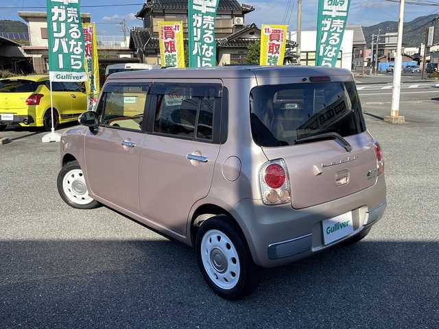 スズキ ラパン ショコラ X 山口県 2014(平26)年 8.9万km シャンパンピンクPM 純正ナビ/SD/BT/AUX/ワンセグTV/バックカメラ/ベージュツートン革シート/純正HIDヘッドライト/オートライト/革巻きステアリング/アイドリングストップ/スマートキー/純正フロアマット/純正ドアバイザー/ETC/電動格納ウインカードアミラー