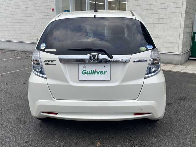 ホンダ フィット ハイブリット 10thアニバーサリー 鳥取県 2012(平24)年 7.9万km プレミアムホワイトパール ＨＤＤナビ/フルセグＴＶ　ＭＳＶ　ＤＶＤ　ＣＤ　ＳＤ　Ｂｌｕｅｔｏｏｔｈ/ＥＴＣ/クルーズコントロール/スマートキー/スペアキー/フロアマット/ドアバイザー/ライトレベライザー/新車保証書/取扱説明書