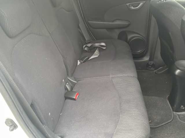 ホンダ フィット ハイブリット 10thアニバーサリー 鳥取県 2012(平24)年 7.9万km プレミアムホワイトパール ＨＤＤナビ/フルセグＴＶ　ＭＳＶ　ＤＶＤ　ＣＤ　ＳＤ　Ｂｌｕｅｔｏｏｔｈ/ＥＴＣ/クルーズコントロール/スマートキー/スペアキー/フロアマット/ドアバイザー/ライトレベライザー/新車保証書/取扱説明書