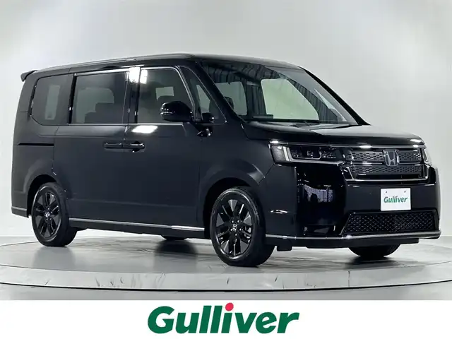 ホンダ ステップワゴン スパーダ eHEV 佐賀県 2025(令7)年 0.1万km未満 クリスタルブラックパール 純正11.4インチナビHonda CONNECTナビ/LXM-247VFLi/(フルセグTV.CD.DVD.Bluetooth）/登録済み未使用車/衝突被害軽減システム/バックカメラ/ブラインドスポットモニター/レーダークルーズコントロール/レーンアシスト/オートマチックハイビーム/オートライト/カーテンエアバッグ/両側パワースライドドア/パワーバックドア/運転席・助手席シートヒーター/ハーフレザーシート/ダブルエアコン/LEDヘッドライト/フォグライト/純正16インチアルミホイール/パドルシフト
