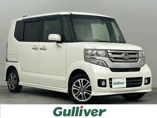 ホンダ Ｎ ＢＯＸ カスタム G Lパッケージ 道央・札幌 2017(平29)年 4.5万km プレミアムホワイトパールⅡ ・４ＷＤ/・社外メモリーナビ/　CD/DVD/SD/BT/フルセグ/・バックカメラ/・ビルトインETC/・ドライブレコーダー/・左側パワースライドドア/・前席シートヒーター/・ステアリングスイッチ/・HIDヘッドライト/・フォグライト/・オートライト/・プッシュスタート/・スマートキー/・社外エンジンスターター/・純正フロアマット/・ドアバイザー