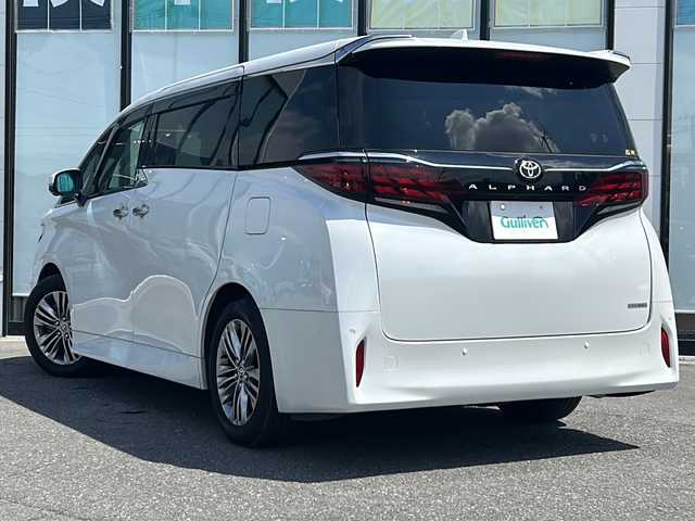 トヨタ アルファード Z 山形県 2023(令5)年 1.2万km プラチナホワイトパールマイカ ４WD/トヨタセーフティセンス/・プリクラッシュブレーキ/・レーダークルーズコントロール/・レーントレーシングアシスト/・ロードサインアシスト/・プロアクティブドライビングアシスト/・レーンチェンジアシスト/・フロントクロストラフィックアラート/ブラインドスポットモニター/前後コーナーセンサー/パノラミックビューモニター/トヨタチームメイト/デジタルインナーミラー/ヘッドアップディスプレイ/純正ナビ/（Bluetooth/AM/FM/フルセグ/USB)/テレビキャンセラー/ステアリングスイッチ/ステアリングヒーター/両側パワースライドドア/ビルトインETC/置くだけ充電/純正エンジンスターター/オートマチックハイビーム/レザーシート/メモリー付きシート/前席・2列目パワーシート/前席・2列目シートヒーター・エアシート/キャプテンシート/後席LEDドームランプ/後席左右独立ムーンルーフ/パワーバックドア/LEDヘッドライト/純正アルミホイール