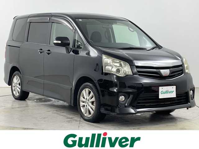 トヨタ ノア Si 道央・札幌 2012(平24)年 12.9万km ブラック ・4WD/寒冷地仕様/・社外メモリナビ/・CD/DVD/USB/SD/iPod/フルセグTV/・Bluetooth接続/・社外フリップダウンモニター/・バックカメラ/オートライト/・社外エンジンスターター/・両側パワースライドドア/・パドルシフト/ETC/・電動格納ミラー/・積込冬タイヤ純正AWセット/・スマートキー/スペアキー/・保証書/取扱説明書