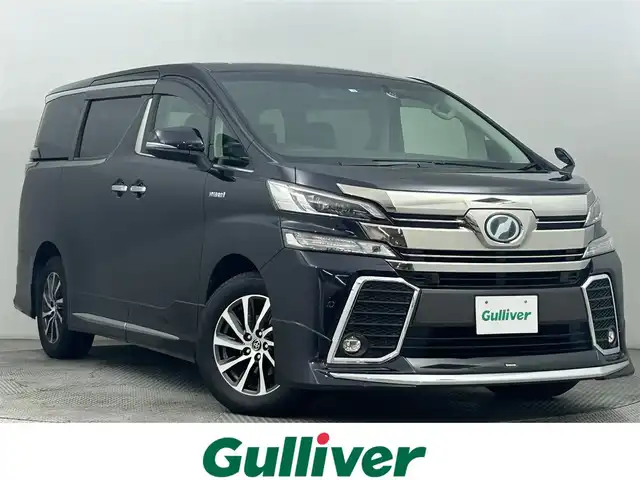 トヨタ ヴェルファイア ハイブリット ZR 道央・札幌 2016(平28)年 6.1万km スパークリングブラックパールクリスタルシャイン ・４WD/・モデリスタエアロ/・純正10インチナビ/　CD/DVD/SD/BT/フルセグ/・純正フリップダウンモニター/・バックカメラ/・ビルトインETC/・社外ドライブレコーダー/・プリクラッシュセーフティ/・レーダークルーズコントロール/・インテリジェントクリアランスソナー/・nanoe/・ハーフレザーシート/・両側パワースライドドア/・パワーバックドア/・LEDヘッドライト/・フォグライト/・オートライト/・プッシュスタート/・スマートキー/・純正フロアマット/・ドアバイザー