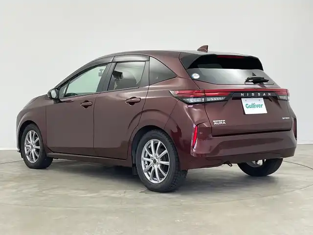 日産 オーラ G レザーエディション 新潟県 2022(令4)年 1.8万km バーガンディー 純正メモリナビ/（BT/FM/AM/フルセグTV）/全周囲カメラ/ステアリングスイッチ/BOSEサウンドスピーカー/デジタルインナーミラー/ブラインドスポットモニター/プロパイロット/置くだけ充電/前方ドライブレコーダー/ウィンカーミラー/電格ミラー/ドアバイザー/ETC2.0/夏タイヤ積載/取扱説明書/保証書