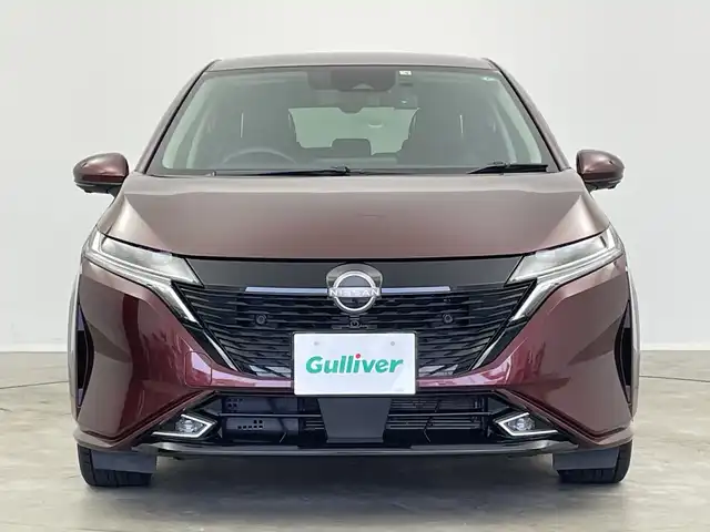 日産 オーラ G レザーエディション 新潟県 2022(令4)年 1.8万km バーガンディー 純正メモリナビ/（BT/FM/AM/フルセグTV）/全周囲カメラ/ステアリングスイッチ/BOSEサウンドスピーカー/デジタルインナーミラー/ブラインドスポットモニター/プロパイロット/置くだけ充電/前方ドライブレコーダー/ウィンカーミラー/電格ミラー/ドアバイザー/ETC2.0/夏タイヤ積載/取扱説明書/保証書