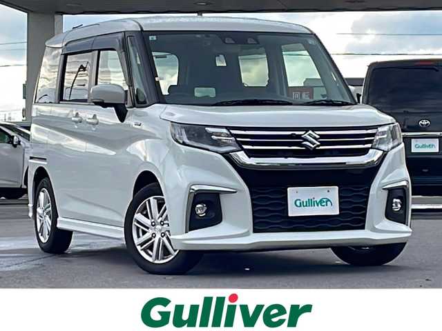 スズキ ソリオ HV MZ 道北・旭川 2021(令3)年 2.5万km ピュアホワイトP ・４ＷＤ/・禁煙車/・両側パワースライドドア/・純正９インチナビ/ＣＤ/ＤＶＤ/ＢＴ/フルセグ/・全方位カメラ/・ステアリングリモコン////デュアルカメラブレーキサポート////・前方衝突警報ブレーキ機能/・前方衝突自動ブレーキ機能/・車線逸脱抑制機能/・踏み間違い防止機能/・ＬＥＤオートライト/・ヘッドアップディスプレイ/・リアサーキュレーター/・ロールサンシェード/・ミラーヒーター/・前席シートヒーター/・ドライブレコーダー/・純正１５インチアルミ/・新車時保証書