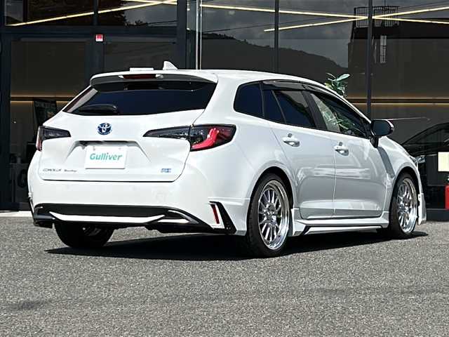 トヨタ カローラツーリング ハイブリッド ダブルバイビー 大阪府 2024(令6)年 0.6万km プラチナホワイトパールマイカ １オーナー　モデリスタエアロ　１０．５型ディスプレイオーディオ　プリクラッシュセーフティー　レーダークルーズコントロール　ハーフレザーシート　レザーパネル　社外18インチホイール　ＨＫＳ車高調　純正パーツあり　デジタルインナーミラー　バックカメラ　前後ドラブレコーダー　ＢＳＭ　コーナーセンサー　ステアリング／シートヒーター　ビルドインＥＴＣ２．０　フルセグテレビ　ウィンカーミラー　プッシュスタート　LEDヘッドライト　黄フォグランプ　純正オーディオ　電動格納ミラー　