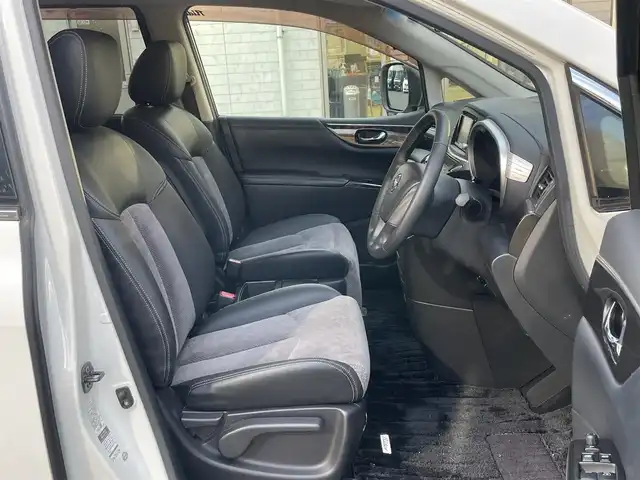 日産 エルグランド ライダー 黒クロス マニュアル 静岡県 2010(平22)年 11.3万km ブリリアントホワイトパール １オーナー　/純正ナビ（HC510D-W）/地デジ　/Bカメラ　/純正後席モニター/両側パワスラ　/木目調パネル　/ハーフレザーシート/ETC　/オートライト　/オーテック18インチAW　/ウィンカーミラー　/スマートキー　/スペアキー　/保証書　/取説