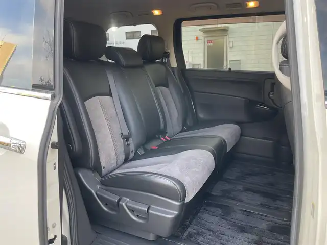 日産 エルグランド ライダー 黒クロス マニュアル 静岡県 2010(平22)年 11.3万km ブリリアントホワイトパール １オーナー　/純正ナビ（HC510D-W）/地デジ　/Bカメラ　/純正後席モニター/両側パワスラ　/木目調パネル　/ハーフレザーシート/ETC　/オートライト　/オーテック18インチAW　/ウィンカーミラー　/スマートキー　/スペアキー　/保証書　/取説