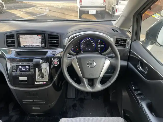 日産 エルグランド ライダー 黒クロス マニュアル 静岡県 2010(平22)年 11.3万km ブリリアントホワイトパール １オーナー　/純正ナビ（HC510D-W）/地デジ　/Bカメラ　/純正後席モニター/両側パワスラ　/木目調パネル　/ハーフレザーシート/ETC　/オートライト　/オーテック18インチAW　/ウィンカーミラー　/スマートキー　/スペアキー　/保証書　/取説