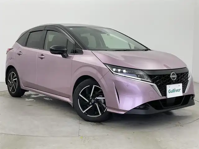日産 ノート X 富山県 2021(令3)年 1.7万km ピンク 純正ナビ（AM/FM/BT/USB/HDMI/フルセグ）/全方位カメラ/ドライブレコーダー/ETC/デジタルインナーミラー/ブラインドスポットモニター/衝突被害軽減システム/レーダークルーズコントロール/レーンキープアシスト/コーナーセンサー/横滑り防止装置/アイドリングストップ/純正アルミホイール/純正フロアマット/オートLEDライト/オートマチックハイビーム/置くだけ充電/スマートキー