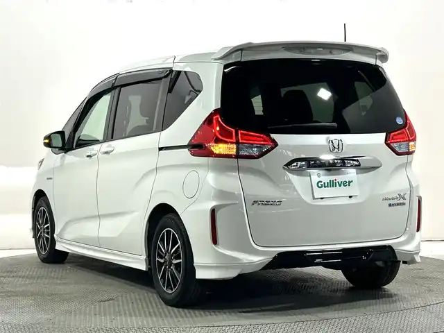 ホンダ フリード ハイブリット モデューロX ホンダセンシング 大阪府 2018(平30)年 6.5万km ホワイトオーキッドパール 純正9インチナビTV 両側パワースライドドア 衝突軽減 レーダークルコン ハーフレザー オートライト ドラレコ スマートキー プッシュスタート