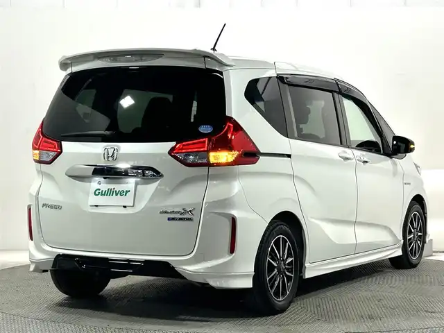 ホンダ フリード ハイブリット モデューロX ホンダセンシング 大阪府 2018(平30)年 6.5万km ホワイトオーキッドパール 純正9インチナビTV 両側パワースライドドア 衝突軽減 レーダークルコン ハーフレザー オートライト ドラレコ スマートキー プッシュスタート