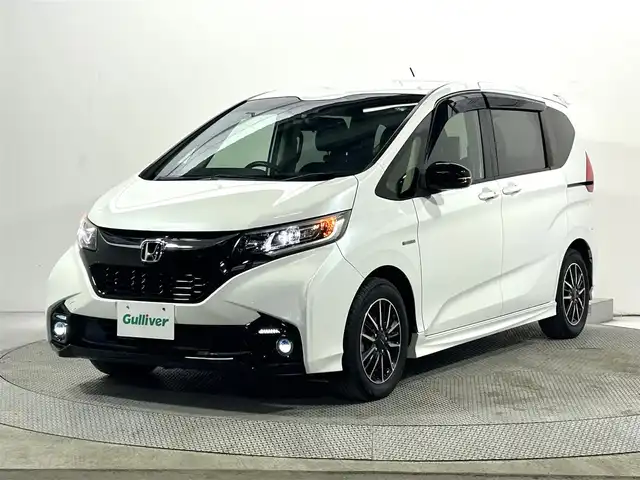 ホンダ フリード ハイブリット モデューロX ホンダセンシング 大阪府 2018(平30)年 6.5万km ホワイトオーキッドパール 純正9インチナビTV 両側パワースライドドア 衝突軽減 レーダークルコン ハーフレザー オートライト ドラレコ スマートキー プッシュスタート