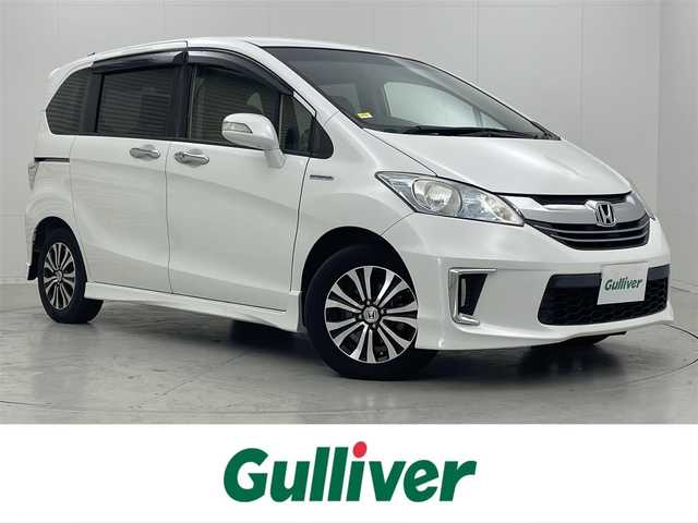 ホンダ フリード ハイブリット ジャストセレクション 茨城県 2014(平26)年 8万km ホワイトオーキッドパール 社外ナビ/ドラレコ/ETC/Bluetooth/フルセグ視聴可/寒冷地仕様/バックカメラ/ハーフレザーシート/純正フロアマット/純正AW
