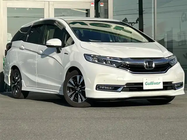 ホンダ シャトル ハイブリッド X ホンダセンシング 愛媛県 2020(令2)年 3.6万km プラチナホワイトパール 純正8型ナビ/バックカメラ/半革温シート/アダプティブクルーズコントロール/衝突被害軽減装置/車線逸脱防止装置/クリアランスソナー/パドルシフト/フロントワイパーデアイサー/前後ドライブレコーダー/LEDヘッドライト/電格ミラー/ヒートミラー/ステアリングリモコン/純正ラバーマット/ISOFIX/シガーソケット/現状サマー(純正AW)(185/60R15)/BRIDGESTONE EcoPia EP150