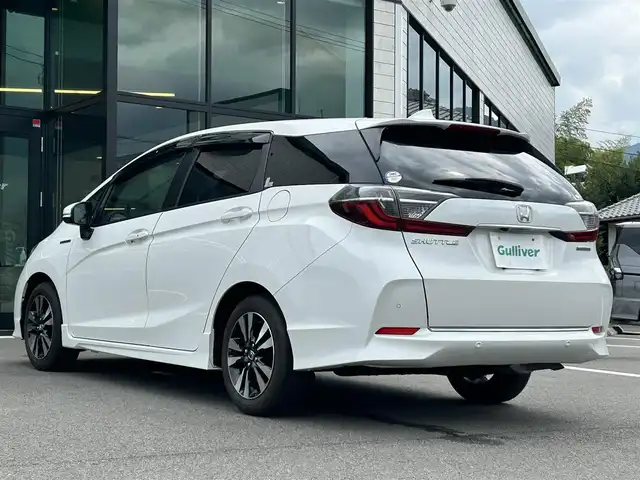 ホンダ シャトル ハイブリッド X ホンダセンシング 愛媛県 2020(令2)年 3.6万km プラチナホワイトパール 純正8型ナビ/バックカメラ/半革温シート/アダプティブクルーズコントロール/衝突被害軽減装置/車線逸脱防止装置/クリアランスソナー/パドルシフト/フロントワイパーデアイサー/前後ドライブレコーダー/LEDヘッドライト/電格ミラー/ヒートミラー/ステアリングリモコン/純正ラバーマット/ISOFIX/シガーソケット/現状サマー(純正AW)(185/60R15)/BRIDGESTONE EcoPia EP150
