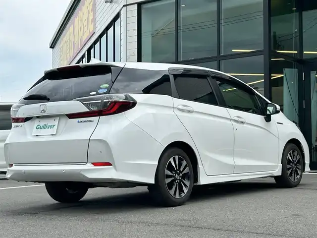 ホンダ シャトル ハイブリッド X ホンダセンシング 愛媛県 2020(令2)年 3.6万km プラチナホワイトパール 純正8型ナビ/バックカメラ/半革温シート/アダプティブクルーズコントロール/衝突被害軽減装置/車線逸脱防止装置/クリアランスソナー/パドルシフト/フロントワイパーデアイサー/前後ドライブレコーダー/LEDヘッドライト/電格ミラー/ヒートミラー/ステアリングリモコン/純正ラバーマット/ISOFIX/シガーソケット/現状サマー(純正AW)(185/60R15)/BRIDGESTONE EcoPia EP150