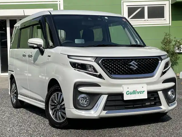 スズキ ソリオ バンディット HV SV 埼玉県 2023(令5)年 1.2万km ピュアホワイトP 純正10インチナビ/純正前後ドライブレコーダー/両側パワースライドドア/衝突被害軽減システム/レーンキープアシスト/後方コーナーセンサー/全方位カメラ/バックカメラ/フロントカメラ/サイドカメラ/レーダークルーズコントロール/ビルトインETC/シートヒーター/フルセグTV/Bluetooth/CD、DVD/LEDヘッドライト/フォグランプ/オートライト/オートマチックハイビーム/純正アルミホイール/純正フロアマット/プッシュスタート/スマートキー