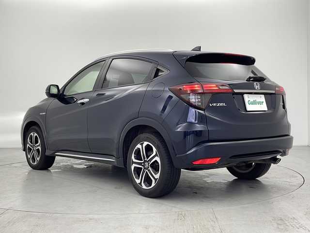 ホンダ ヴェゼル ハイブリッド Z ホンダセンシング 愛知県 2019(平31)年 5.9万km ミッドナイトブルービームM 禁煙/スペアキー/純正ナビ/・フルセグ/・Bluetooth/・DVD/・CD/ビルトインETC2.0/バックカメラ/電動パーキングブレーキ/オートブレーキホールド/追従型クルコン/ABS/横滑り防止装置/衝突軽減ブレーキ/誤発進抑制装置/車線逸脱抑制装置/先行者発進お知らせ装置/車線維持支援システム/標識認識機能/歩行者事故低減ステアリング/前席シートヒータ/ハーフレザーシート/純正フロアマット/LEDヘッドライト/オートライト/電動格納ミラー/取扱説明書