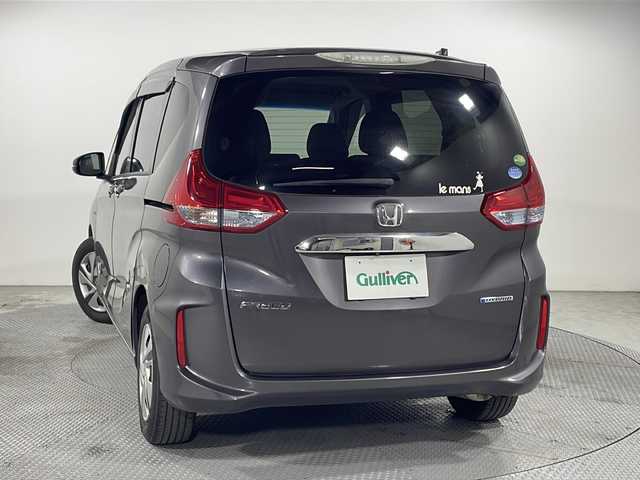 ホンダ フリード ハイブリット G ホンダセンシング 広島県 2020(令2)年 3.6万km モダンスティールM ｓｔｒａｄａナビ/バックカメラ/後席フリップダウンモニター/両側パワースライドドア/ＥＴＣ/レーダークルーズコントロール/衝突被害軽減/レーンキープアシスト/フルセグ/ＤＶＤ/踏み間違い防止/ＬＥＤヘッドライト/純正15インチホイールキャップ(185/65//R15)/エアバッグ(運転席/助手席/サイド/カーテン)