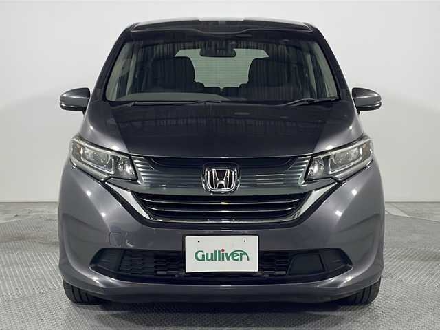 ホンダ フリード ハイブリット G ホンダセンシング 広島県 2020(令2)年 3.6万km モダンスティールM ｓｔｒａｄａナビ/バックカメラ/後席フリップダウンモニター/両側パワースライドドア/ＥＴＣ/レーダークルーズコントロール/衝突被害軽減/レーンキープアシスト/フルセグ/ＤＶＤ/踏み間違い防止/ＬＥＤヘッドライト/純正15インチホイールキャップ(185/65//R15)/エアバッグ(運転席/助手席/サイド/カーテン)