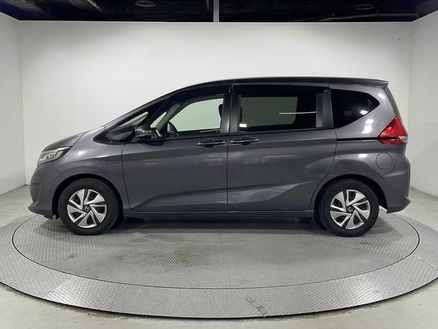 ホンダ フリード ハイブリット G ホンダセンシング 広島県 2020(令2)年 3.6万km モダンスティールM ｓｔｒａｄａナビ/バックカメラ/後席フリップダウンモニター/両側パワースライドドア/ＥＴＣ/レーダークルーズコントロール/衝突被害軽減/レーンキープアシスト/フルセグ/ＤＶＤ/踏み間違い防止/ＬＥＤヘッドライト/純正15インチホイールキャップ(185/65//R15)/エアバッグ(運転席/助手席/サイド/カーテン)