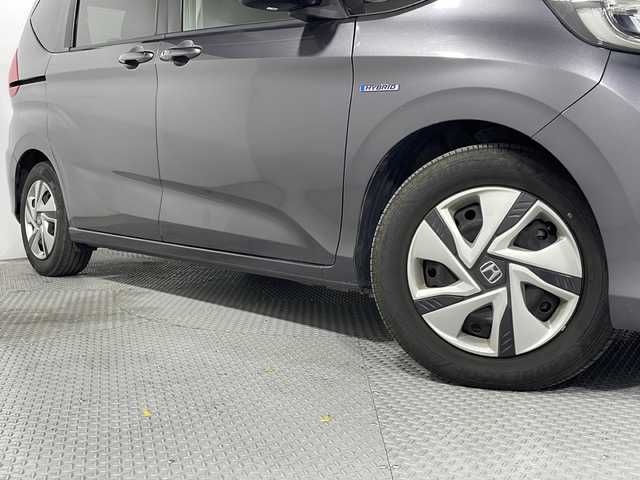 ホンダ フリード ハイブリット G ホンダセンシング 広島県 2020(令2)年 3.6万km モダンスティールM ｓｔｒａｄａナビ/バックカメラ/後席フリップダウンモニター/両側パワースライドドア/ＥＴＣ/レーダークルーズコントロール/衝突被害軽減/レーンキープアシスト/フルセグ/ＤＶＤ/踏み間違い防止/ＬＥＤヘッドライト/純正15インチホイールキャップ(185/65//R15)/エアバッグ(運転席/助手席/サイド/カーテン)