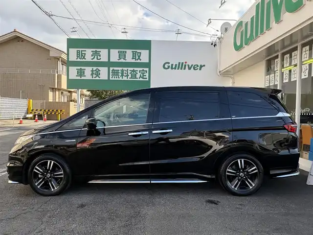 ホンダ オデッセイ ハイブリッド 愛知県 2017(平29)年 4.5万km クリスタルブラックパール ワンオーナー/ホンダセンシング車/両側パワースライドドア/アルパインフィリップダウンモニター/クルコン/パワーシート/純正ナビ/フルセグテレビ/Bluetooth/ビルトインETC/ドラレコ前後/ハーフレザーシート/ブラインドスポットインフォメーション（側後方検知機能）/CMBS/LKAS/AC100V/バックカメラ/純正アルミホイール/純正マット/プッシュスタート/取説、保証書あります。