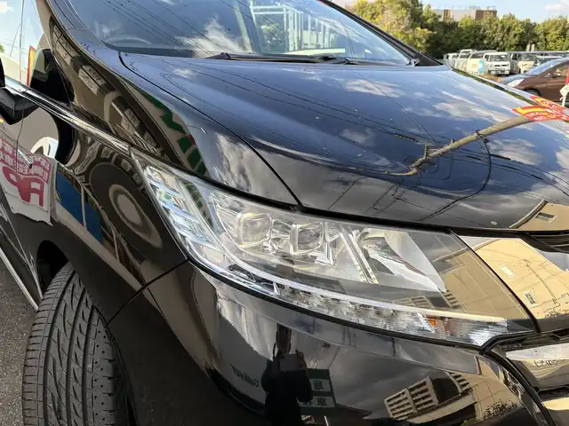 ホンダ オデッセイ ハイブリッド 愛知県 2017(平29)年 4.5万km クリスタルブラックパール ワンオーナー/ホンダセンシング車/両側パワースライドドア/アルパインフィリップダウンモニター/クルコン/パワーシート/純正ナビ/フルセグテレビ/Bluetooth/ビルトインETC/ドラレコ前後/ハーフレザーシート/ブラインドスポットインフォメーション（側後方検知機能）/CMBS/LKAS/AC100V/バックカメラ/純正アルミホイール/純正マット/プッシュスタート/取説、保証書あります。