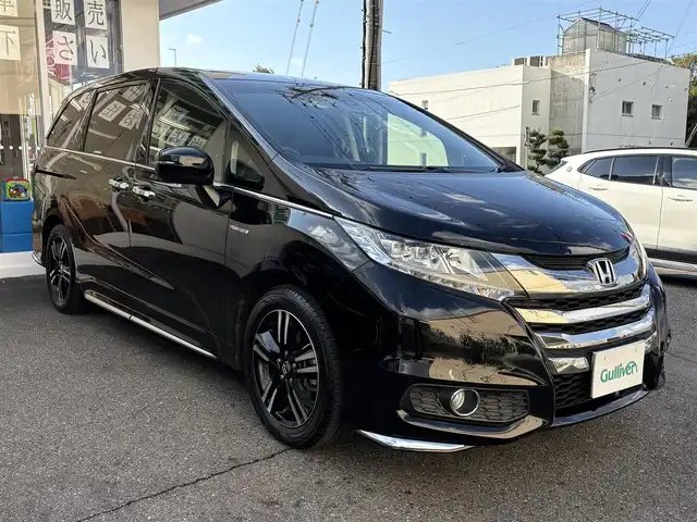 ホンダ オデッセイ ハイブリッド 愛知県 2017(平29)年 4.5万km クリスタルブラックパール ワンオーナー/ホンダセンシング車/両側パワースライドドア/アルパインフィリップダウンモニター/クルコン/パワーシート/純正ナビ/フルセグテレビ/Bluetooth/ビルトインETC/ドラレコ前後/ハーフレザーシート/ブラインドスポットインフォメーション（側後方検知機能）/CMBS/LKAS/AC100V/バックカメラ/純正アルミホイール/純正マット/プッシュスタート/取説、保証書あります。