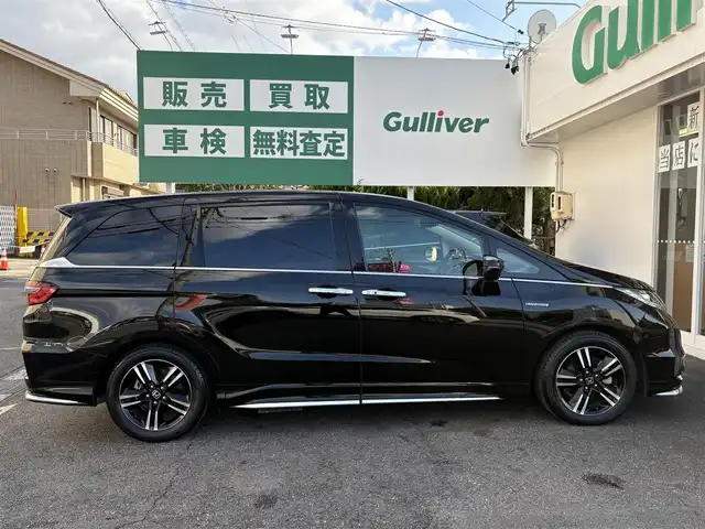 ホンダ オデッセイ ハイブリッド 愛知県 2017(平29)年 4.5万km クリスタルブラックパール ワンオーナー/ホンダセンシング車/両側パワースライドドア/アルパインフィリップダウンモニター/クルコン/パワーシート/純正ナビ/フルセグテレビ/Bluetooth/ビルトインETC/ドラレコ前後/ハーフレザーシート/ブラインドスポットインフォメーション（側後方検知機能）/CMBS/LKAS/AC100V/バックカメラ/純正アルミホイール/純正マット/プッシュスタート/取説、保証書あります。