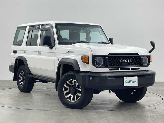 トヨタ ランドクルーザー AX 群馬県 2024(令6)年 1.8万km スーパーホワイトⅡ 純正ナビ　バックカメラ　フルセグＴＶ　電動デフロック　ＥＴＣ　前後ドラレコ　ＬＥＤヘッドライト　ハーフレザーシート　クルーズコントロール　ウッドコンビステアリング　衝突被害軽減ブレーキ　禁煙車