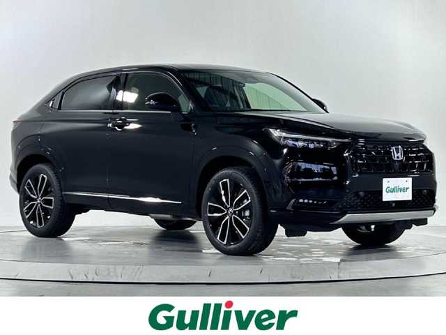 ホンダ ヴェゼル ハイブリッド e:HEV Z 佐賀県 2025(令7)年 3.2万km クリスタルブラックパール 純正9型ナビ/（ＡＭ/ＦＭ/CD/DVD/Bluetooth/フルセグTV）/バックカメラ/ビルトインETC/オートエアコン/クルーズコントロール(追従あり)/衝突被害軽減システム/ハンドルヒーター/ハンズフリー/置くだけ充電/オートブレーキホールド/シーケンシャルウィンカー/アップルカープレイ/アンドロイドオート/SOSコール/電子パーキング/ブラインドスポットモニター/LEDヘッドライト/盗難防止装置/オートライト/オートマチックハイビーム/スマートキー/プッシュスタート/USB入力端子/純正フロアマット/純正18インチアルミホイール
