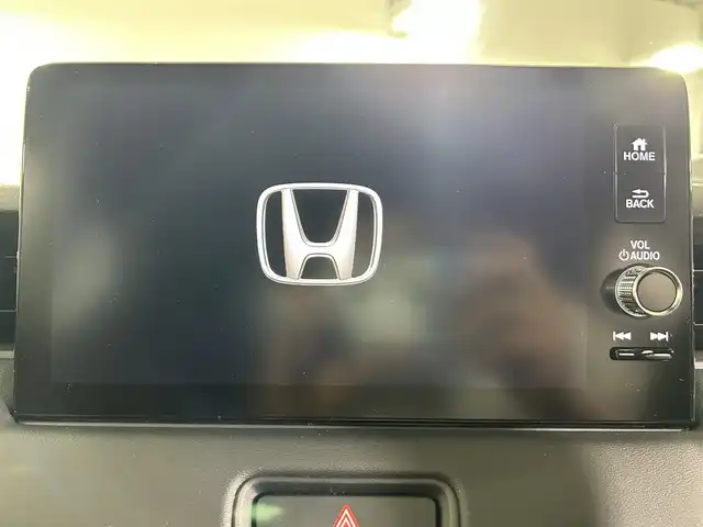 ホンダ ヴェゼル ハイブリッド e:HEV Z 佐賀県 2025(令7)年 3.2万km クリスタルブラックパール 純正9型ナビ/（ＡＭ/ＦＭ/CD/DVD/Bluetooth/フルセグTV）/バックカメラ/ビルトインETC/オートエアコン/クルーズコントロール(追従あり)/衝突被害軽減システム/ハンドルヒーター/ハンズフリー/置くだけ充電/オートブレーキホールド/シーケンシャルウィンカー/アップルカープレイ/アンドロイドオート/SOSコール/電子パーキング/ブラインドスポットモニター/LEDヘッドライト/盗難防止装置/オートライト/オートマチックハイビーム/スマートキー/プッシュスタート/USB入力端子/純正フロアマット/純正18インチアルミホイール