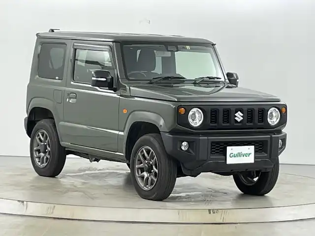 スズキ ジムニー XC 愛知県 2022(令4)年 1.5万km ジャングルグリーン 純正ディスプレイオーディオ(PVH-9300DVSZS)/DISC/Bluetooth/USB/バックモニター/ビルトインＥＴＣ/ドライブレコーダー/衝突軽減ブレーキ/横滑り防止装置/前席シートヒーター/クルーズコントロール/レーンキープアシスト/ステアリングスイッチ/ダウンヒルアシストコントロール/アイドリングストップ/オートマチックハイビーム/前後ドライブレコーダー/純正16インチアルミホイール/純正フロアマット/プッシュスタート/スマートキー/ＬＥＤライト